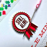 Still Alive Needle Minder
